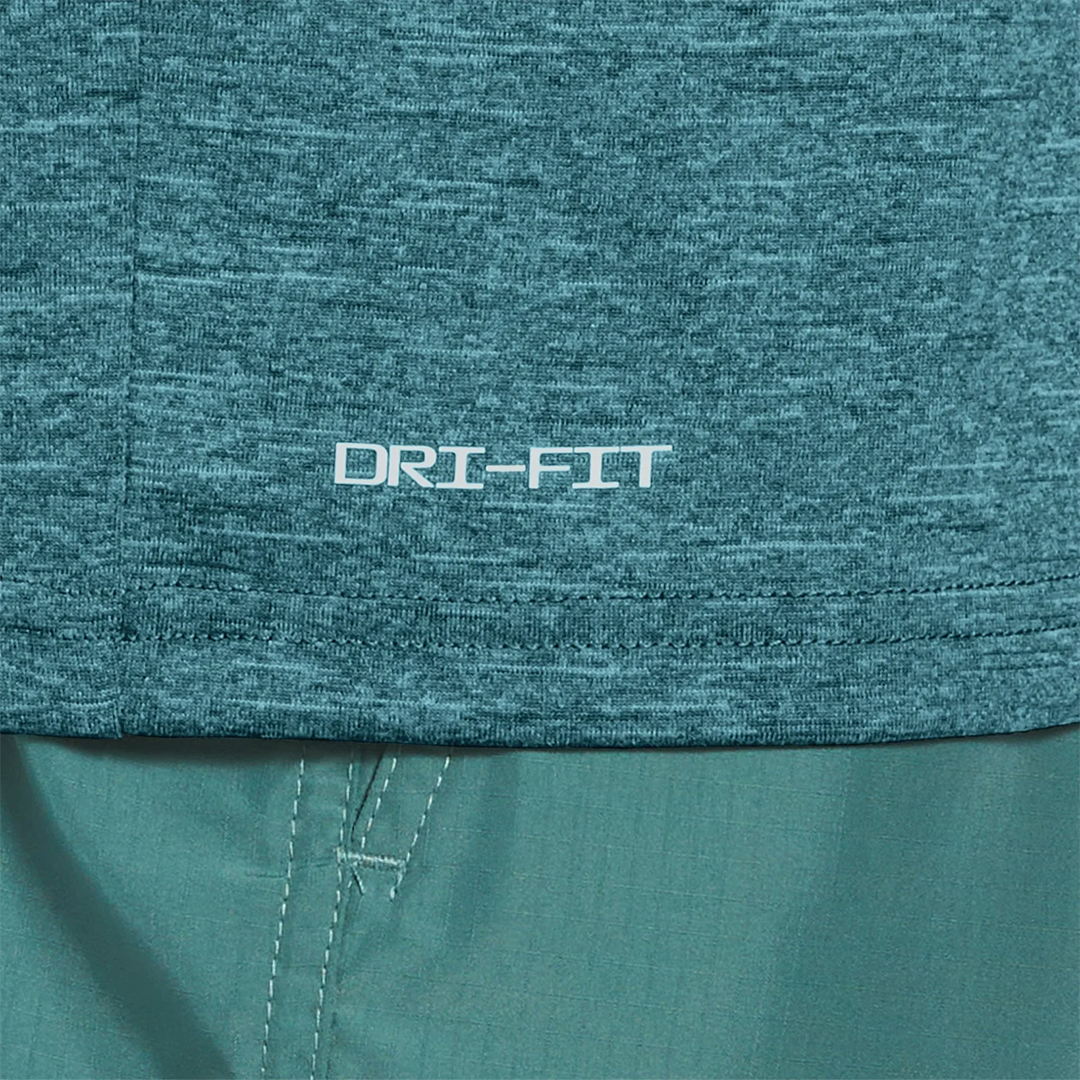 Close-up of teal fabric with &#39;DRI-FIT&#39; logo