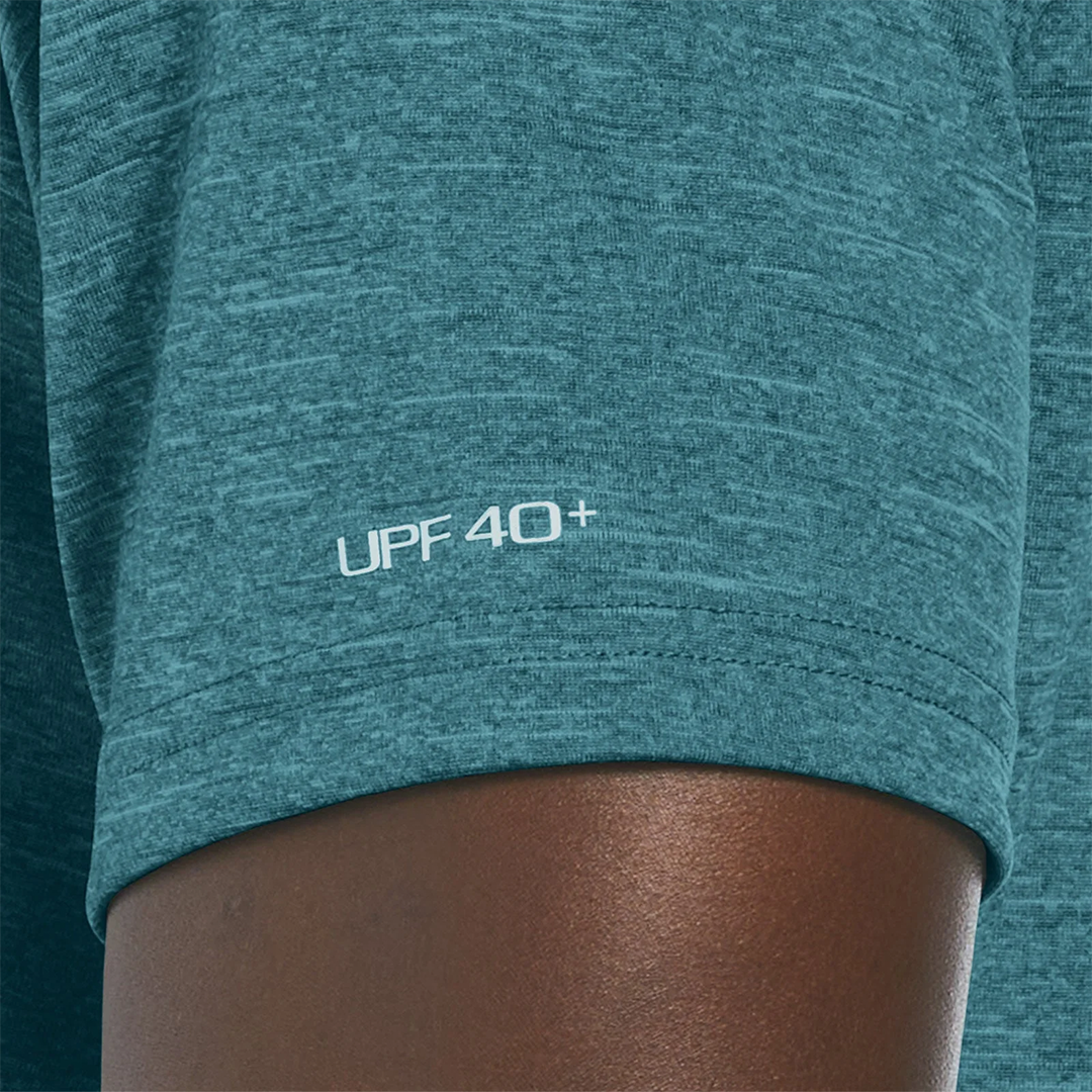 Teal athletic shirt with &#39;UPF 40+&#39; text on a person wearing it.