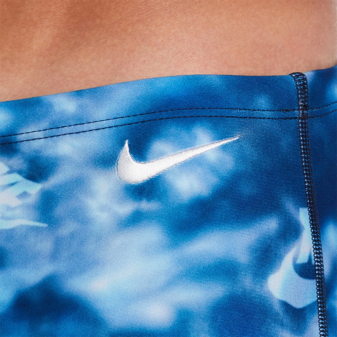 Blue athletic shorts with a Nike logo on a blurred background